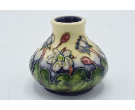 Miniature Moorcroft vase decorated with a floral scene, 65mm wide, silver line.  