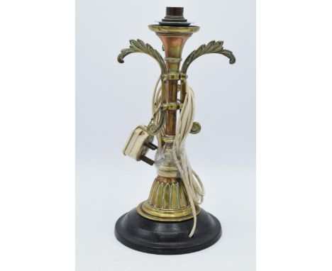 Early 20th century heavy cast brass and metal lamp base mounted onto heavy metal base, 34cm tall, untested.  