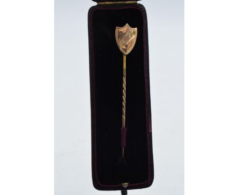 9ct gold (tests as or better) stick pin with a shield finial, 1.6 grams, in original box, 65mm tall.  