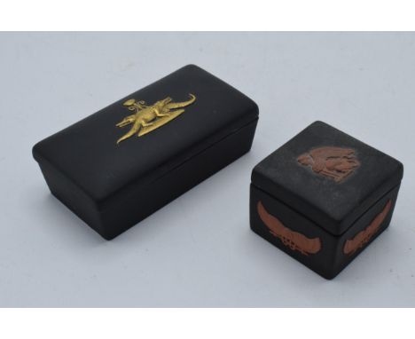 Wedgwood Egyptian Jasperware in black, one trinket with gold relief and the other in terracotta (2), 9cm longest.  In good co