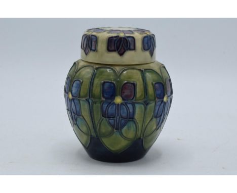 Moorcroft ginger jar and cover decorated with floral design, 11cm tall, silver line.  In good condition with no obvious damag