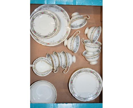 Shelley tea ware in the Rose and Bead pattern 10775 to include 8 trios, 4 spare side plates and saucers, a milk jug, sugar bo