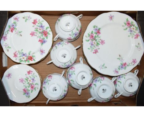 Royal Albert dinner ware in a pink floral design to include 6 soup bowls, 6 saucers, 6 side plates and 6 dinner plates (24). 
