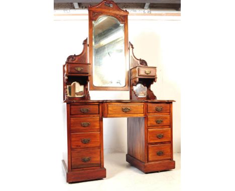 A Victorian 19th century mahogany dressing table. Having large cheval mirror to top, flanked by small trinket / jewellery dra