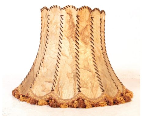 A large Art Deco early 20th century circa 1930s cow hide leather lamp shade. The shade having a faceted form with hand sewn s