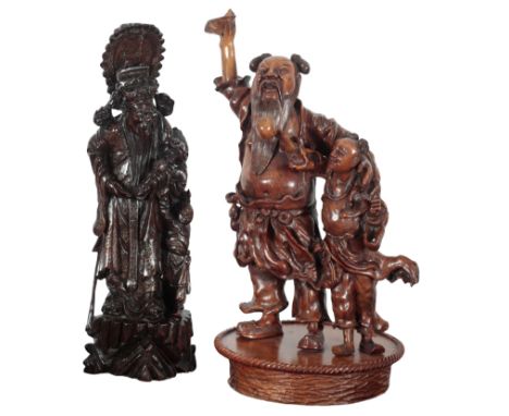 A CHINESE CARVED WOOD LAMP BASE 20th century, in the form of a figural group, the electrical fitments formally attached to th