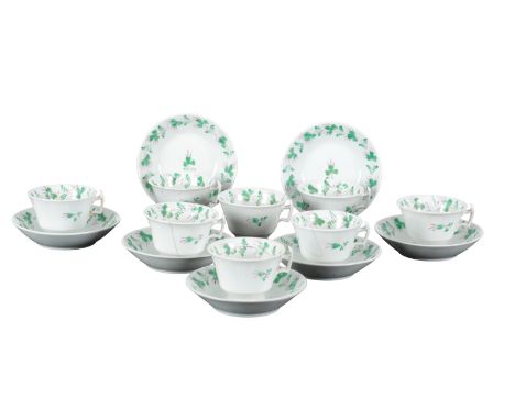 A 19TH CENTURY STAFFORDSHIRE PORCELAIN PART TEA SERVICE including eight cups and seven saucers, decorated with green floral b