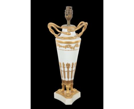 AN EARLY 19TH CENTURY CONTINENTAL PORCELAIN AND ORMOLU MOUNTED TABLE LAMP of Neoclassical design, with twin snake handles, th