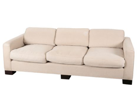 A CONTEMPORARY SOFA BY CHRISTIAN LIAIGRE&nbsp;with beige covers and further loose white cotton covers, on block legs, 63cm hi