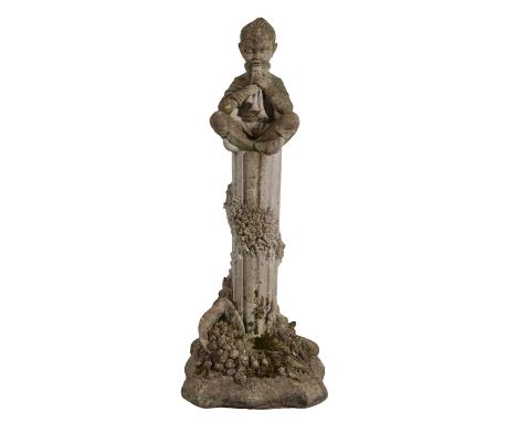 A RECONSTITUTED STONE FIGURE OF A BOY seated playing pipes on top of a fluted column, on a moulded square base, 87cm high