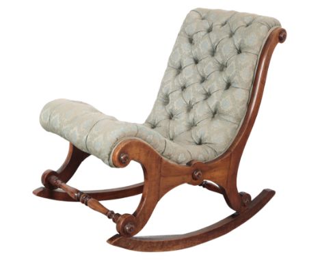 A VICTORIAN WALNUT SLIPPER CHAIR the button back silk covers with all over floral design, on twin sled supports with applied 
