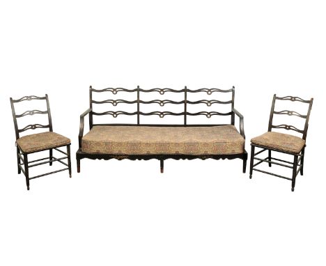 A SET OF FOUR GEORGE III STYLE EBONISED AND PARCEL GILT DINING CHAIRS with shaped and pierced ladder backs over square caned 