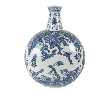 A CHINESE PORCELAIN BLUE AND WHITE MOON FLASK dragons to each side of the body highlighted in white and incised, 45.5cm high