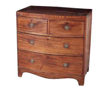 A REGENCY MAHOGANY BOWFRONT CHEST OF DRAWERS the caddy top over two short and two long graduated drawers, above a shaped apro