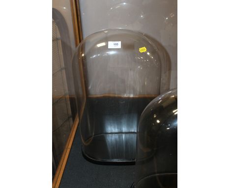 A LARGE GLASS CLOCK DOME AND STAND