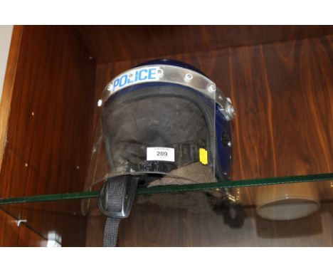 A VINTAGE POLICE RIOT HELMET