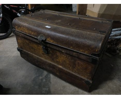 A LARGE TIN TRUNK