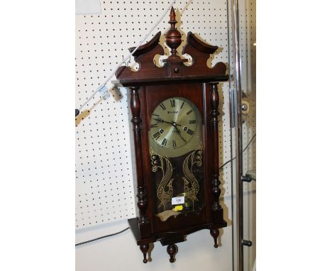 A VINTAGE 31 DAY WALL CLOCK