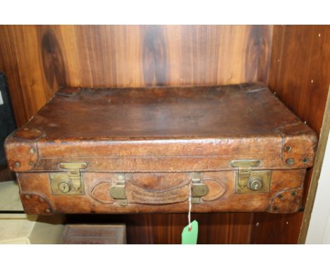 A GOOD QUALITY VINTAGE LEATHER SUITCASE, initialed to the top E.B.T. Scots Guards, brass fittings, leather corner protectors,