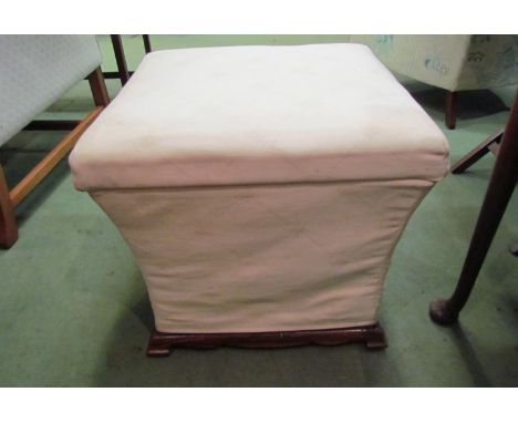 A Victorian rosewood box seat stool the hinged seat over a bracket foot and shaped base on ceramic castors     