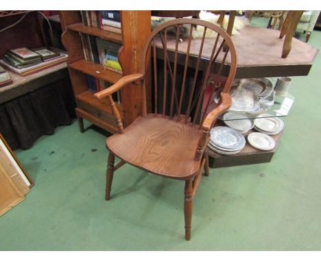 A 19th Century elm and ash stick back hooped armchair on turned legs joined by an 'H' stretcher