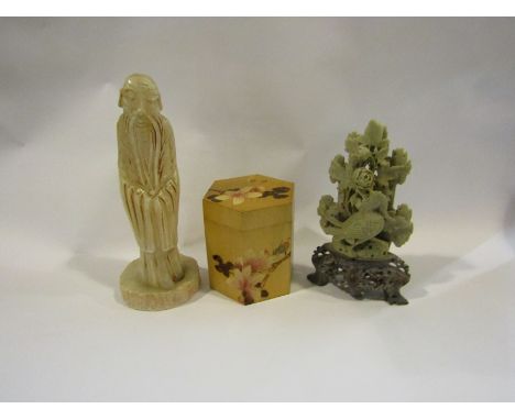 A carved alabaster lamp base depicting a rooted sage, missing some parts. A carved soapstone scene depicting a bird amongst f