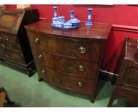 A mid 19th Century crossbanded flame mahogany bow front chest of three graduating long drawers on out swept bracket feet. 91c