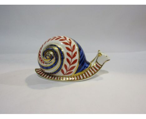 A Royal Crown Derby snail, ceramic stopper