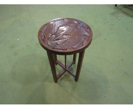 A carved oak jardiniere stand/side table with fish design, 45cm tall x 30cm diameter