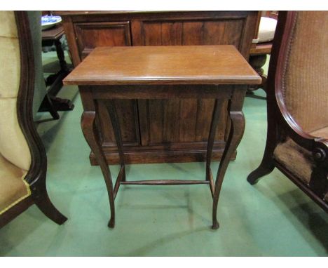 A Victorian mahogany side table with slender cabriole legs on stretcher base, 65cm x 48cm x 30cm
