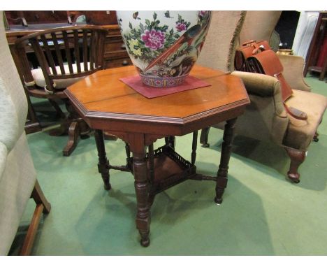 A hexagonal late Victorian occasional table with spindle turned legs, 'X' stretcher with pierced, galleried under-tier, 76cm 