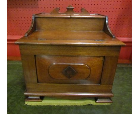 An Arts &amp; Crafts walnut table top vanity cabinet with rising lids &amp; internal mirror. Rising front with four compartme