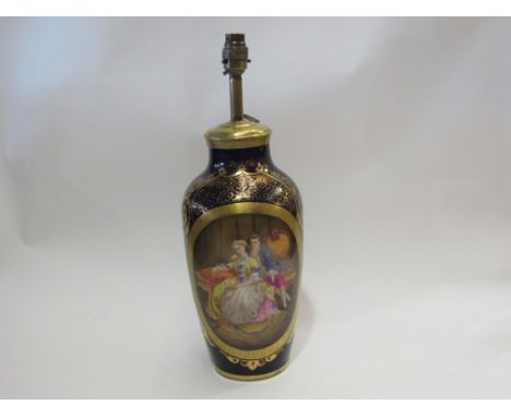 A Victorian Continental porcelain gilt and cobalt hand-painted vase lamp with scene of couple     