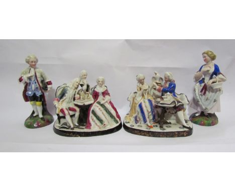 A pair of figures and two figural groups "taking tea" and card game (4)     