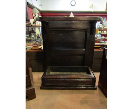 An 18th Century and later provincial oak umbrella/stick stand with later tin drip tray. 61cm x 52cm x 22cm