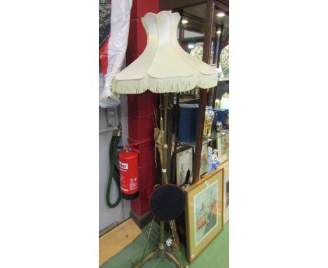 :A brass oil lamp stand converted to a standard lamp on scroll tripod base, flared form shade     
