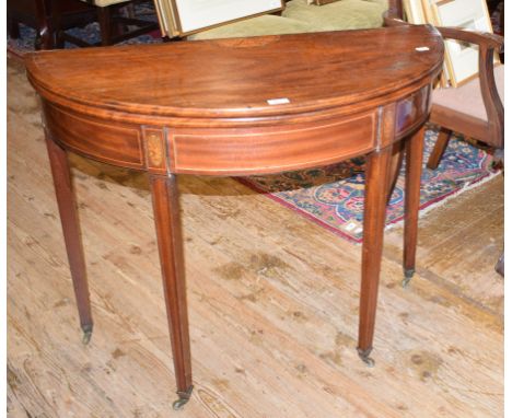 A George III inlaid mahogany D shaped card table, on tapering square legs, 97 cm wide 