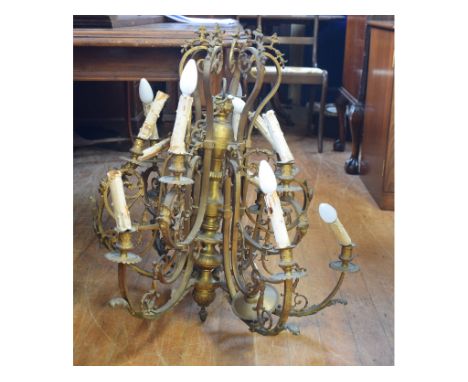 A gilt brass twelve light chandelier, fitted for electricity (needs re-wiring), 74 cm wide 