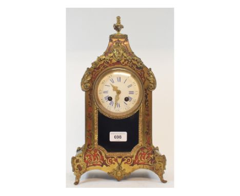 A late 19th century French mantel clock, the 9 cm diameter enamel dial with Roman numerals, fitted an eight day movement, in 