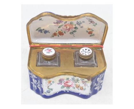 A 19th century enamel travelling ink set, with floral decoration, the gilt metal interior with an inkwell and sander, 10 cm w
