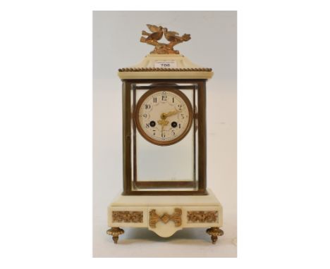 A late 19th century mantel clock, the 8 cm diameter enamel dial with Arabic numerals and floral swags, fitted an eight day mo