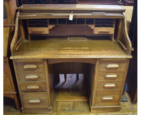 A Lebus oak roll top desk, 121 cm wide, and a 19th century walnut secretaire chest, the secretaire drawer above two long draw