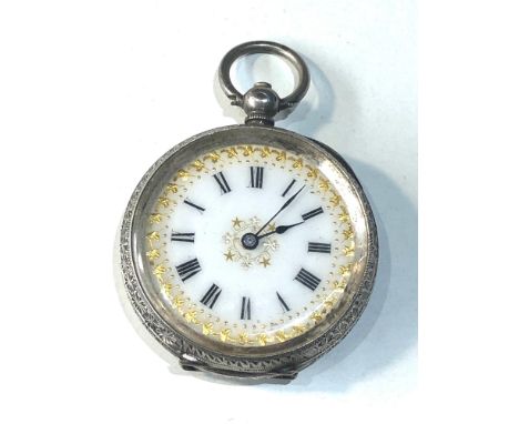 Antique ladies silver and enamel faced fob watch in good clean condition and working order winds and ticks case measures appr