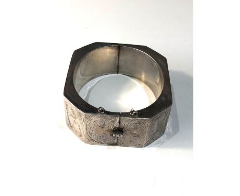 Unusual shaped vintage silver bangle measures approx 2.5cm wide 