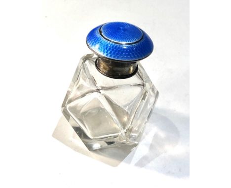 Antique silver and enamel top perfume bottle measures approx height 8cm complete with stopper light enamel edge wear 