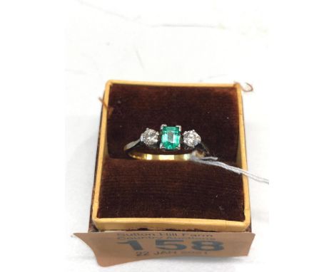 Vintage 18ct gold emerald and diamond ring ,set with central emerald and diamond either side emerald measures approx 5mm by 3