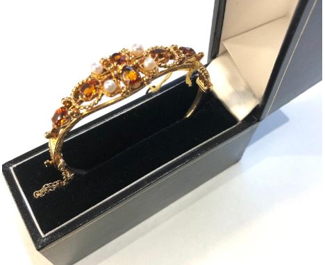 Fine 9ct gold pearl and gem set bangle in good condition weight 17.3g measures approx 6.1cm by 5.6cm 