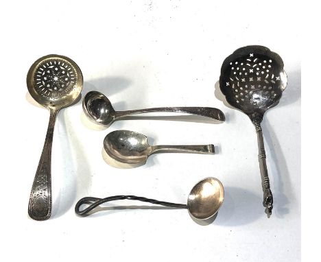 Selection of silver items include antique tea caddy spoon shifter spoons etc total weight 110g 