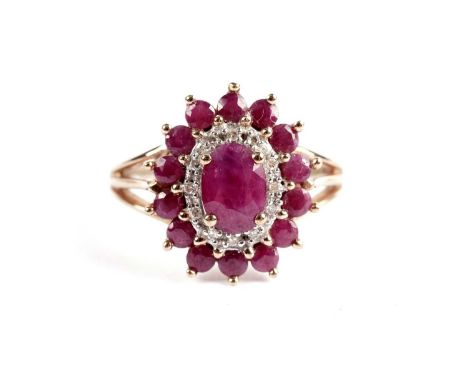 A ruby and diamond cluster ring, in yellow gold, stamped '9K', size P, 3.6g gross.