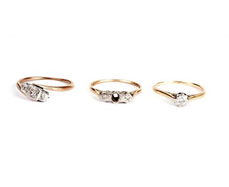 A diamond single stone ring, the round-brilliant cut diamond weighing approximately 0.16 carats, stamped indistinctly, likely